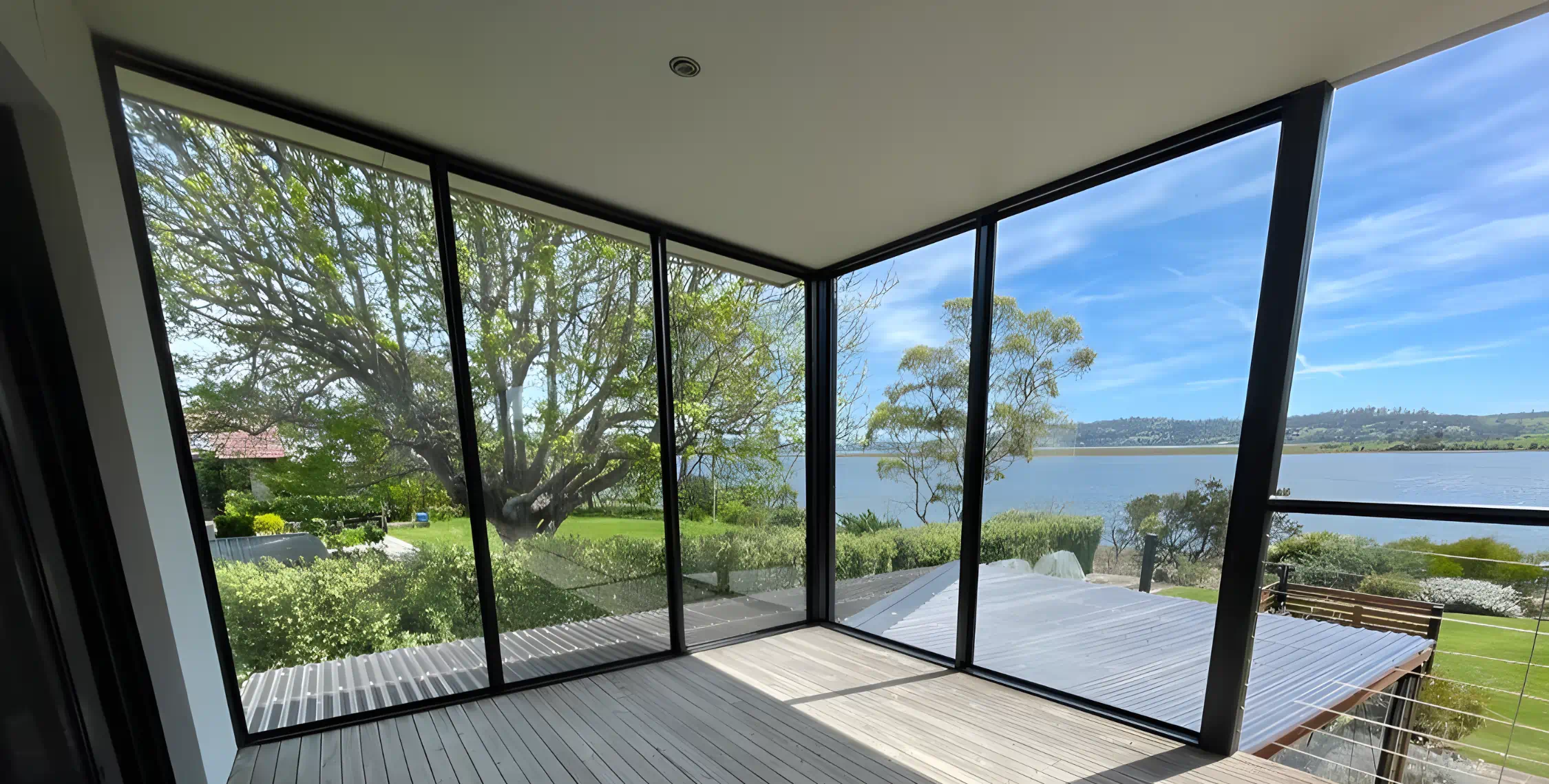 Sunlit room with scenic lake view