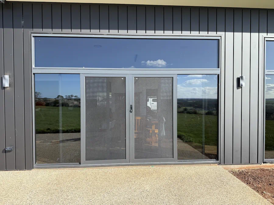 Sliding glass door with screen mesh