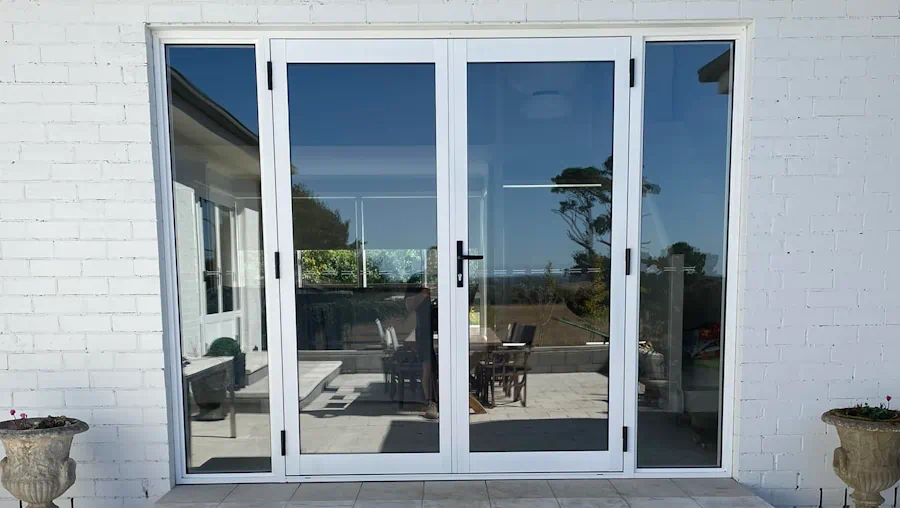 Glass doors opening to a scenic patio view